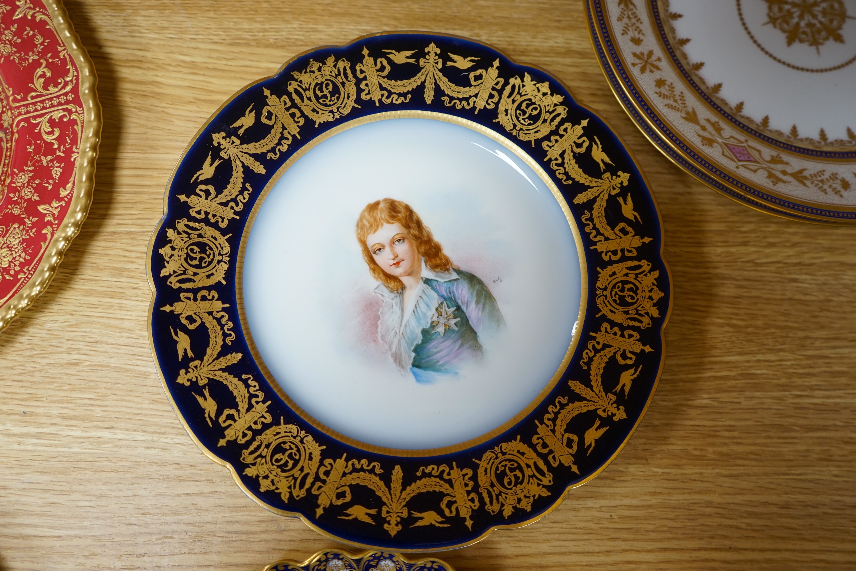 A collection of English porcelain plates, highlights include a Royal Doulton fruit painted cabinet plate signed F Harper, a Royal Worcester flower painted cabinet plate signed E Phillips, and Aynsley plate painted with a